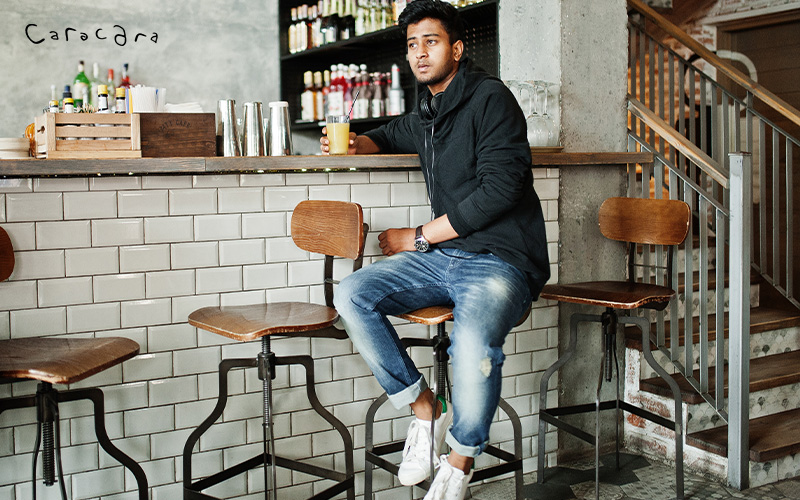 People sitting on a comfortable bar stool
